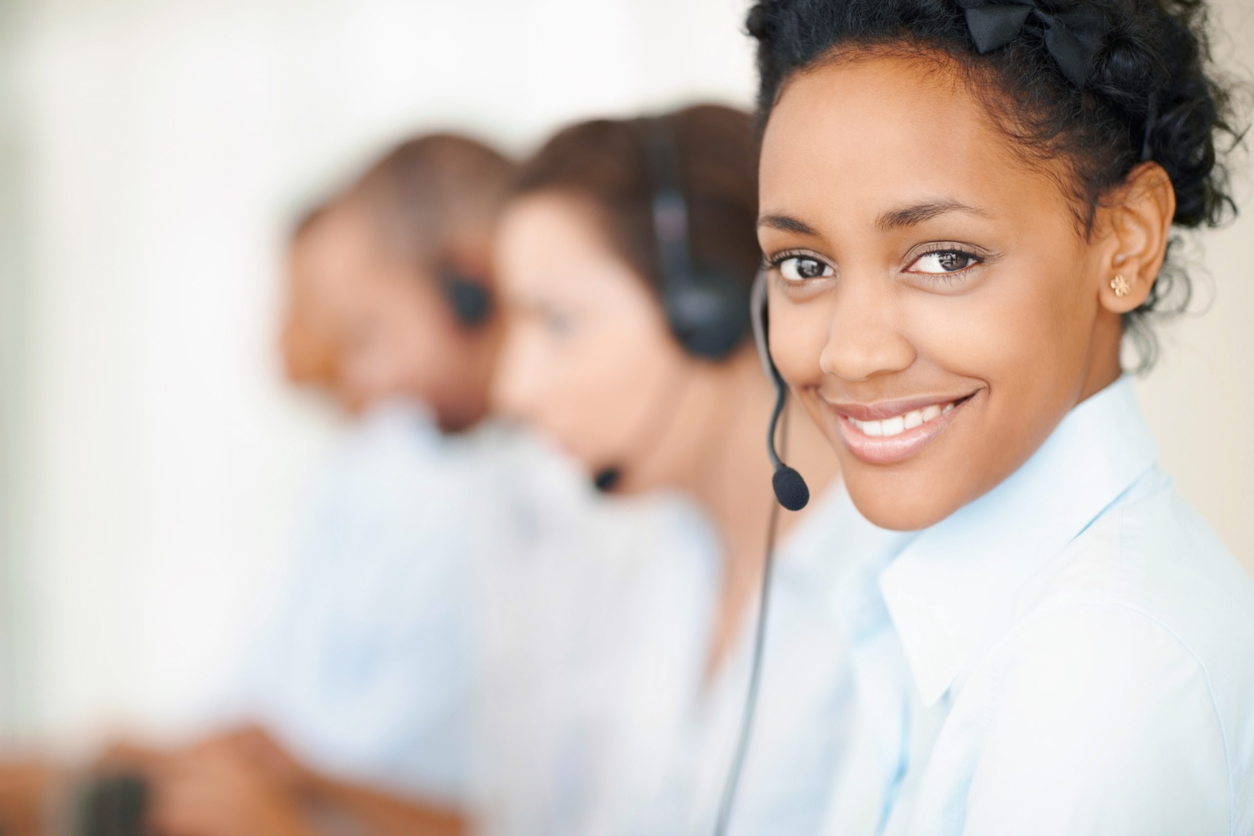 Image of smiling call center employees